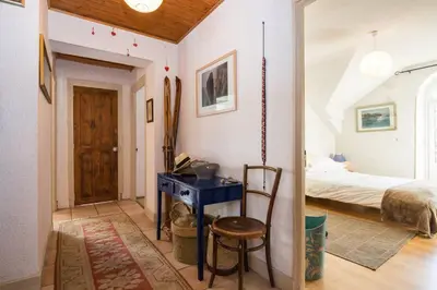 a bedroom with a bed and a desk in a room at Les Fourges in Saint-Gervais-les-Bains