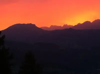 a sunset with mountains in the background at Les Fourges in Saint-Gervais-les-Bains