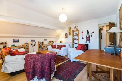 a living room with a couch and a table at Les Fourges in Saint-Gervais-les-Bains