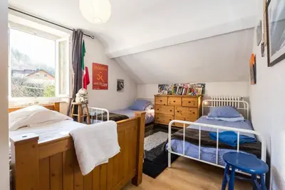 a bedroom with two bunk beds and a window at Les Fourges in Saint-Gervais-les-Bains