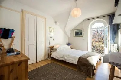 a bedroom with a bed and a large window at Les Fourges in Saint-Gervais-les-Bains