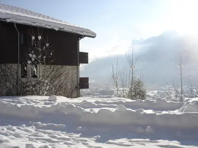 a pile of snow in front of a house at Edelweiss in Samoëns