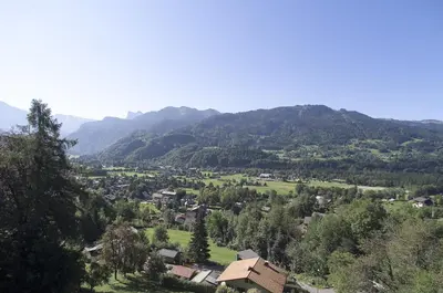 a town in a valley with mountains in the background at Edelweiss in Samoëns