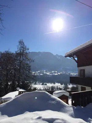 a pile of snow in front of a house at Edelweiss in Samoëns