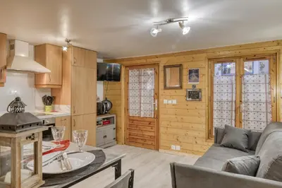 a living room with a couch and a table at Studio 