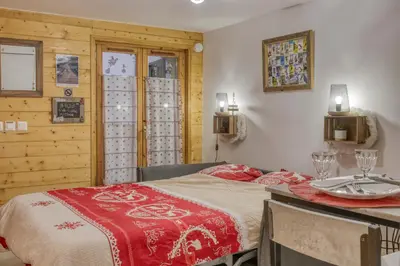 a bedroom with a bed and a table with plates on it at Studio 