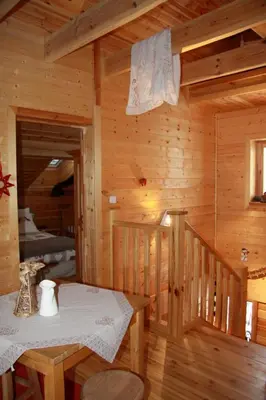 a dining room with a table in a log cabin at Chalet La Grande Ourse in Saint-Gervais-les-Bains