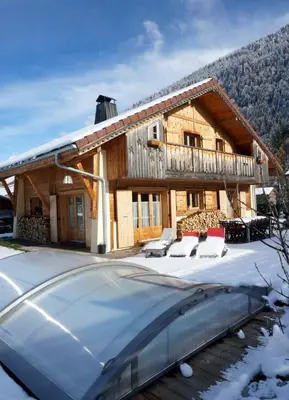 a house with a car parked in front of it at Chalet La Grande Ourse in Saint-Gervais-les-Bains