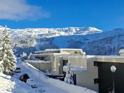 a white apartment building with a blue sky in the background at Appartement spacieux au centre station avec balcon, 3 pièces pour 8 personnes - FR-1-425-2 in Flaine