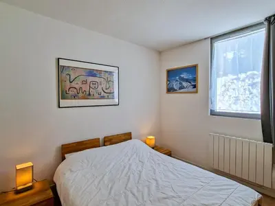 a bedroom with a bed and a window at Appartement 3 pièces à Flaine, 6 pers, moderne et confortable - FR-1-425-3 in Flaine