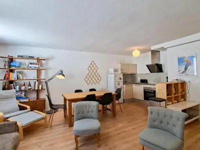 a living room with a couch and a kitchen at Appartement 3 pièces à Flaine, 6 pers, moderne et confortable - FR-1-425-3 in Flaine