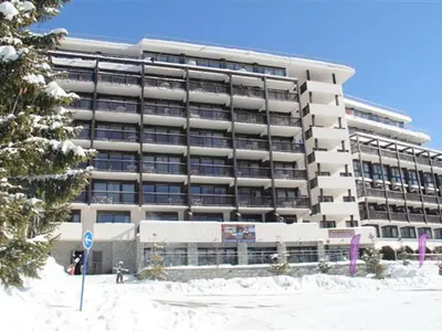 a large building with snow in front of it at Appartement lumineux 4 pièces à Flaine, 8 personnes, terrasse, accès spa - FR-1-425-18 in Flaine