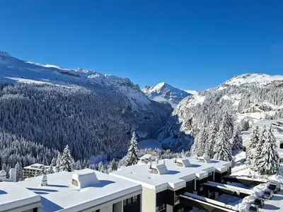a building with snow on it with mountains in the background at Appartement lumineux 4 pièces à Flaine, 8 personnes, terrasse, accès spa - FR-1-425-18 in Flaine