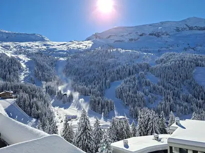 a view of a snow covered mountain with a lake at Appartement lumineux 4 pièces à Flaine, 8 personnes, terrasse, accès spa - FR-1-425-18 in Flaine