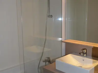 a bathroom with a shower and a white sink at Appartement lumineux 4 pièces à Flaine, 8 personnes, terrasse, accès spa - FR-1-425-18 in Flaine
