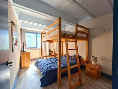 a bedroom with a bunk bed with a ladder at Appartement rénové près des pistes - Balcon, 5/6 pers. - FR-1-425-47 in Flaine
