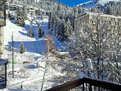 a snow covered mountain with trees and buildings at Appartement rénové près des pistes - Balcon, 5/6 pers. - FR-1-425-47 in Flaine