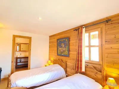 a bedroom with two beds and a window at Chalet spacieux 12 pers. à Flaine avec Sauna & Cheminée - FR-1-425-4 in Flaine