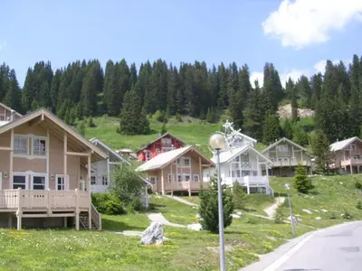 a row of houses on a hill with a street light at Chalet spacieux 12 pers. à Flaine avec Sauna & Cheminée - FR-1-425-4 in Flaine