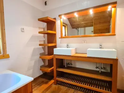 a bathroom with two sinks and a mirror at Chalet spacieux 12 pers. à Flaine avec Sauna & Cheminée - FR-1-425-4 in Flaine