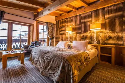a bedroom with a large bed in a room at Fer à Cheval in Megève
