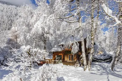 a cabin in the snow with snow covered trees at Mazot les Tines in Chamonix-Mont-Blanc