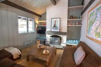 a living room with a couch and a fireplace at Stunning Views Chamonix in Chamonix-Mont-Blanc