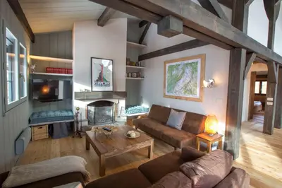 a living room with a couch and a fireplace at Stunning Views Chamonix in Chamonix-Mont-Blanc