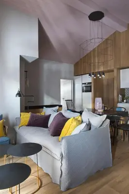 a living room with a couch and a table at Le petit M Chamonix au pied du Brévent in Chamonix-Mont-Blanc