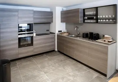 a large kitchen with wooden cabinets and a sink at Luxury appart – Megève – АЕ202 in Megève