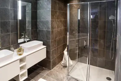 a bathroom with a glass shower and a sink at Megève appart – 2 bedroms – AW301 in Megève