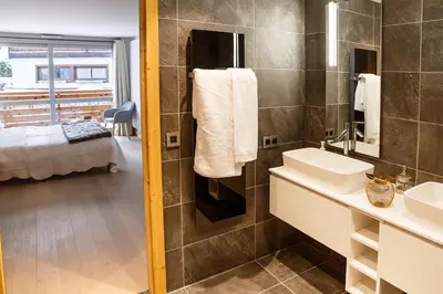 a bathroom with a sink and a shower at Megève appart – 2 bedroms – AW301 in Megève