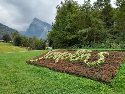 a garden with the word exit spelled out in flowers at Samoëns studio in Samoëns