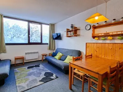 a living room with a couch and a table at Studio spacieux pour 4 personnes, proche des pistes - FR-1-425-74 in Flaine