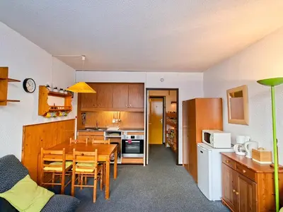 a kitchen and dining room with a table and chairs at Studio spacieux pour 4 personnes, proche des pistes - FR-1-425-74 in Flaine
