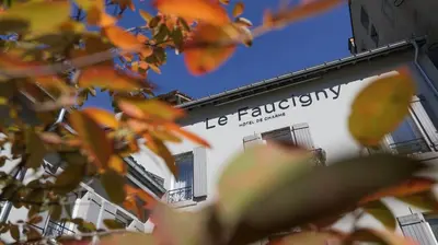 a building with the sign for le flecticism at Le Faucigny - Hotel de Charme & SPA in Chamonix-Mont-Blanc