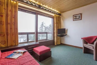 a kitchen with a sink and a microwave at Résidence Pierre & Vacances Le Mont d'Arbois in Megève