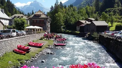 a group of boats on a river in a village at Le Bivouac in Sixt