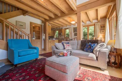 a dining room and living room with a table and chairs at Chalets d'en haut - Zaria - Happy Rentals in Argentiere