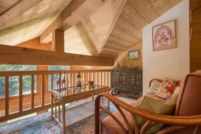 a bedroom with a bed in a log cabin at Chalets d'en haut - Zaria - Happy Rentals in Argentiere
