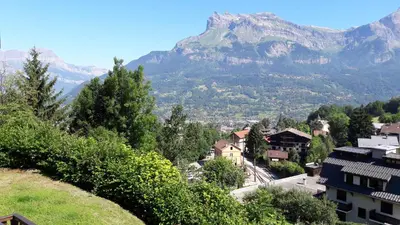 a view of a village with a mountain in the background at Appartement Saint Gervais les Bains in Saint-Gervais-les-Bains
