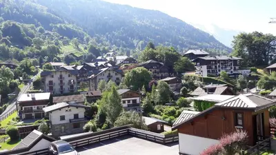 a small village in the mountains with houses at Appartement Saint Gervais les Bains in Saint-Gervais-les-Bains