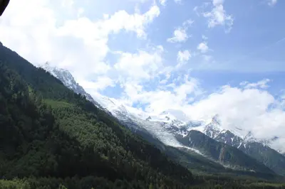 a view of a mountain range with snow capped mountains at Apartment Aiglons - Central Chamonix Mountain Haven in Chamonix-Mont-Blanc