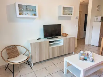 a living room with a pink couch and a table at Apartment Crespin by Interhome in Saint-Gervais-les-Bains