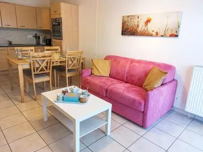 a kitchen with wooden cabinets and a wooden table at Apartment Crespin by Interhome in Saint-Gervais-les-Bains
