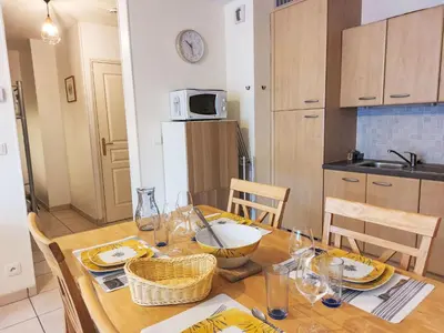 a living room with a table and a couch at Apartment Crespin by Interhome in Saint-Gervais-les-Bains