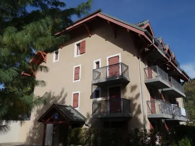 a view of a house with mountains in the background at Apartment Les erables by Interhome in Saint-Gervais-les-Bains