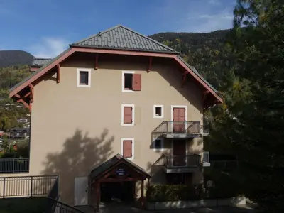 a view of a town with trees and a mountain at Apartment Les erables by Interhome in Saint-Gervais-les-Bains