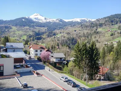 an apartment building with a black facade at Apartment Fleurs des Alpes-1 by Interhome in Saint-Gervais-les-Bains