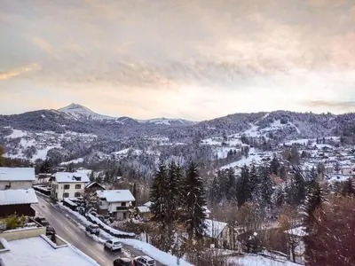 a view of a town with snow covered mountains at Apartment Fleurs des Alpes-1 by Interhome in Saint-Gervais-les-Bains